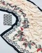 Decorative saree with floral patterns on a white background