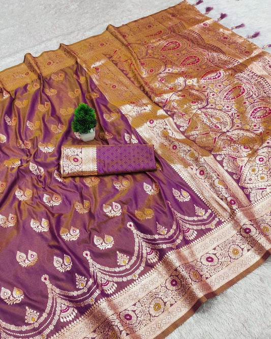 Purple and gold saree with intricate patterns on a light background